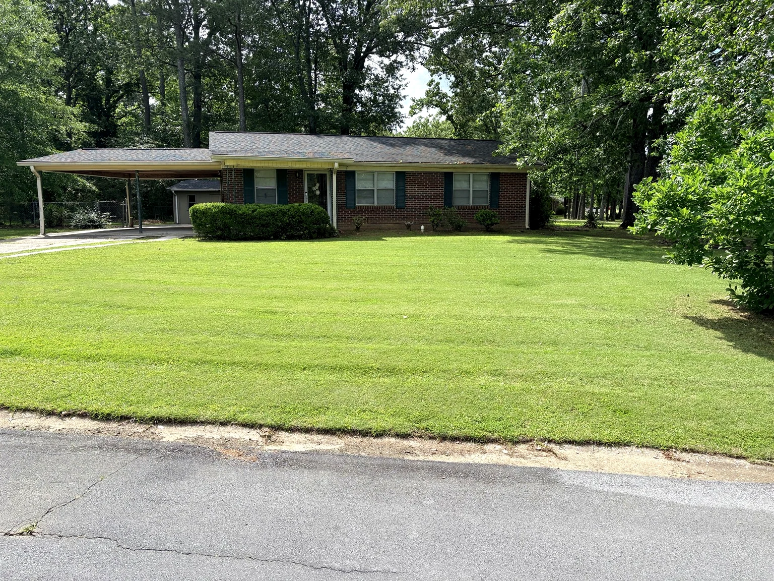 Residential property lawn maintained by Mowed Down Lawn Care
